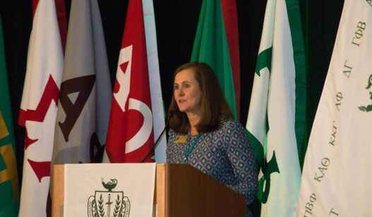 Patty O'Neill speaking at podium